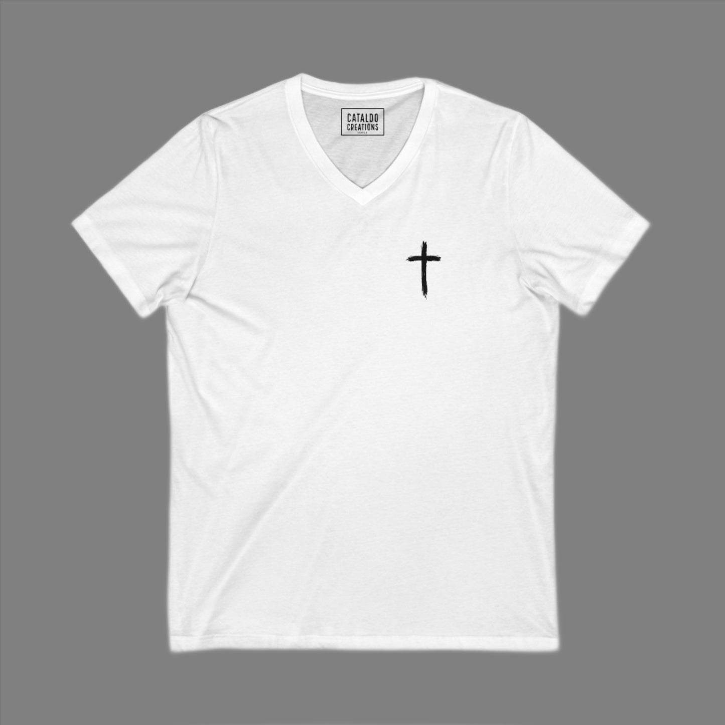 The 'Be Bold As A Lion' v-neck tee. The lion face pops with its gorgeous, lifelike markings throughout. In a big bold font, a reminder of God's word in Proverbs 28:1 from the Bible, to "Be Bold As A Lion". With a small cross on the front chest and available in different colors (and styles!) this t-shirt is one you will feel fearless wearing! Cataldo Creations Christian clothing. Faith Based apparel