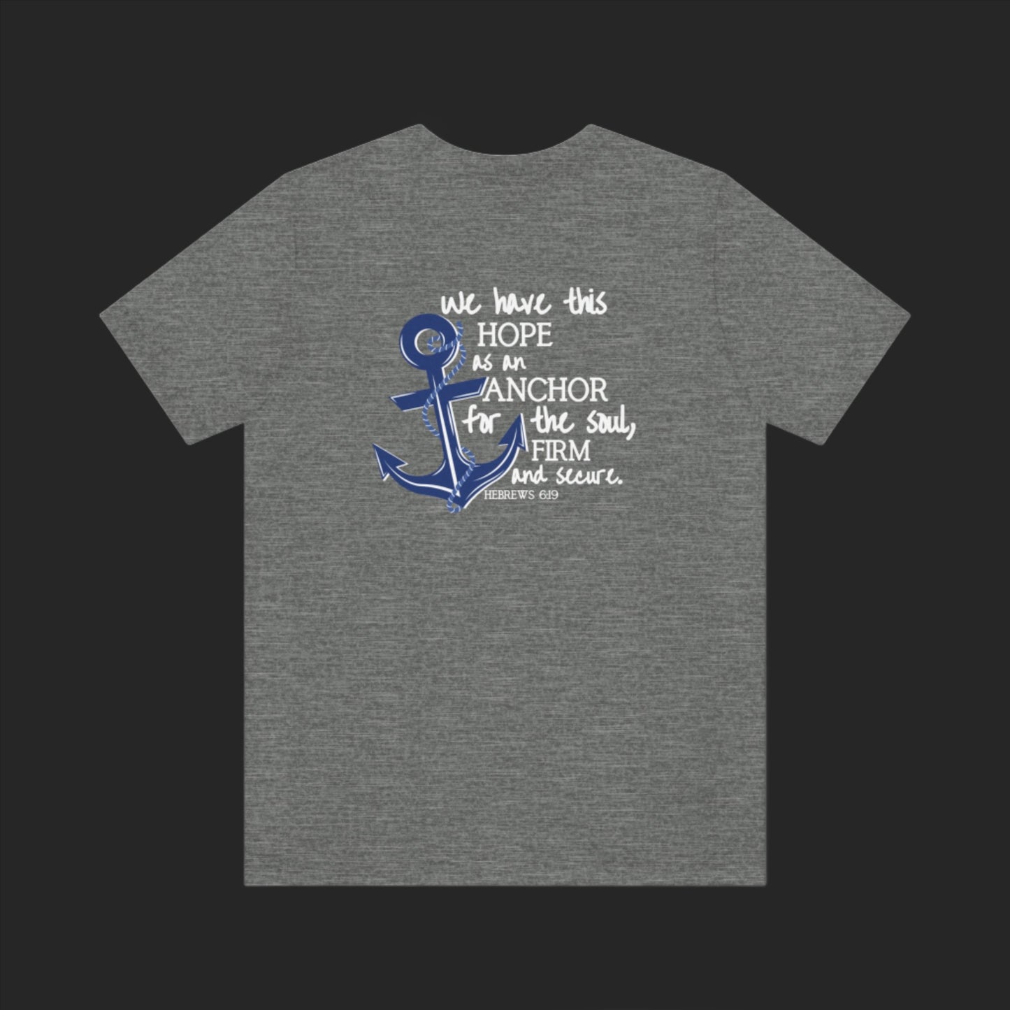 We have this hope as an anchor for the soul, firm and secure. Hebrews 6:19. This nautical Christian crewneck tee features a small anchor on the front with a large anchor and the Hebrews 6:19 bible verse in decorative font down the back. Cataldo Creations Christian Clothing, Christian T-Shirt, Christian Apparel. Bible Verse And Scripture Tees