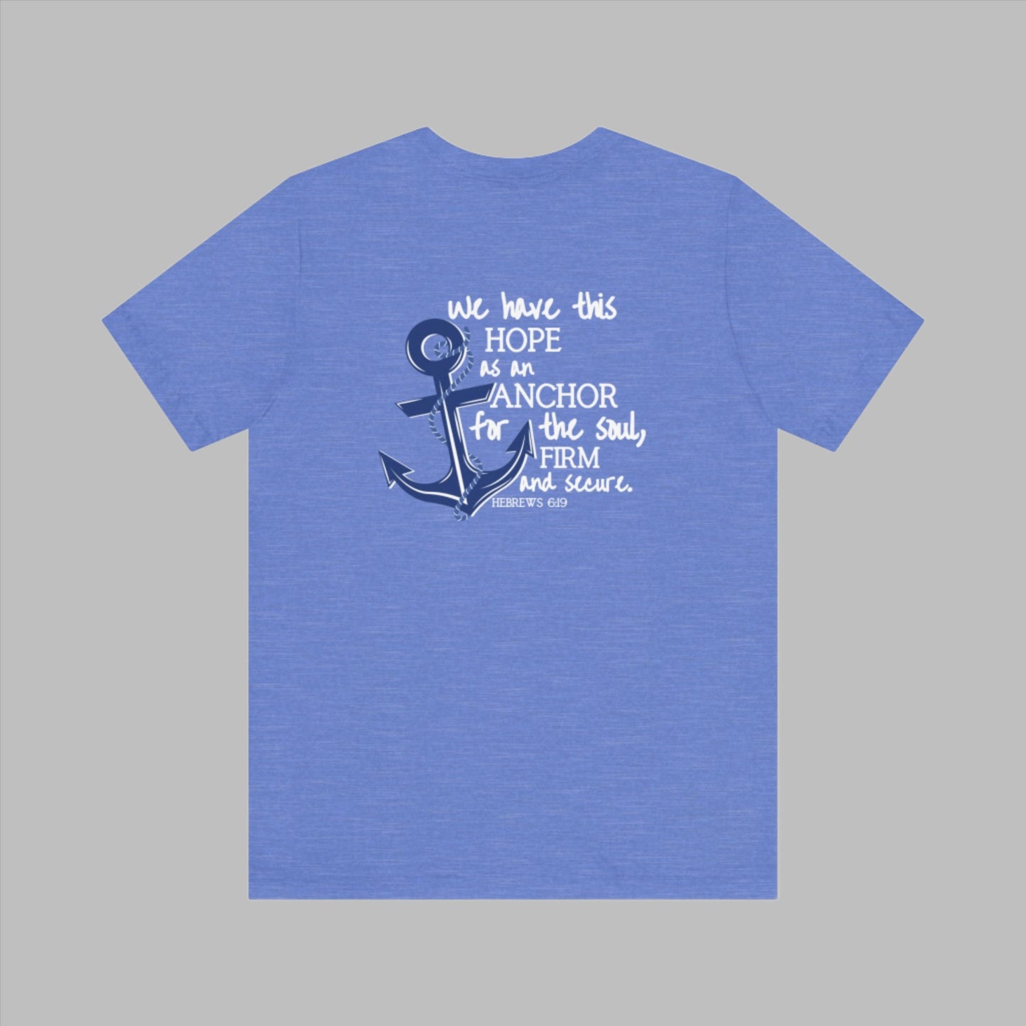 We have this hope as an anchor for the soul, firm and secure. Hebrews 6:19. This nautical Christian crewneck tee features a small anchor on the front with a large anchor and the Hebrews 6:19 bible verse in decorative font down the back. Cataldo Creations Christian Clothing, Christian T-Shirt, Christian Apparel. Bible Verse And Scripture Tees