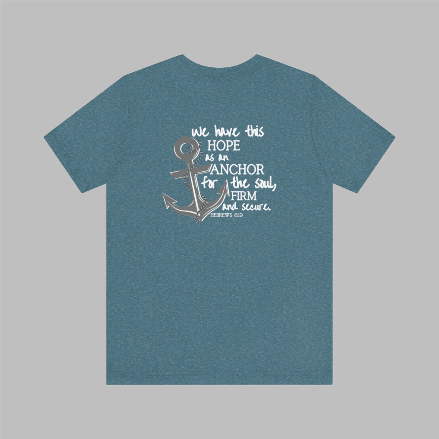 We have this hope as an anchor for the soul, firm and secure. Hebrews 6:19. This nautical Christian crewneck tee features a small anchor on the front with a large anchor and the Hebrews 6:19 bible verse in decorative font down the back. Cataldo Creations Christian Clothing, Christian T-Shirt, Christian Apparel. Bible Verse And Scripture Tees
