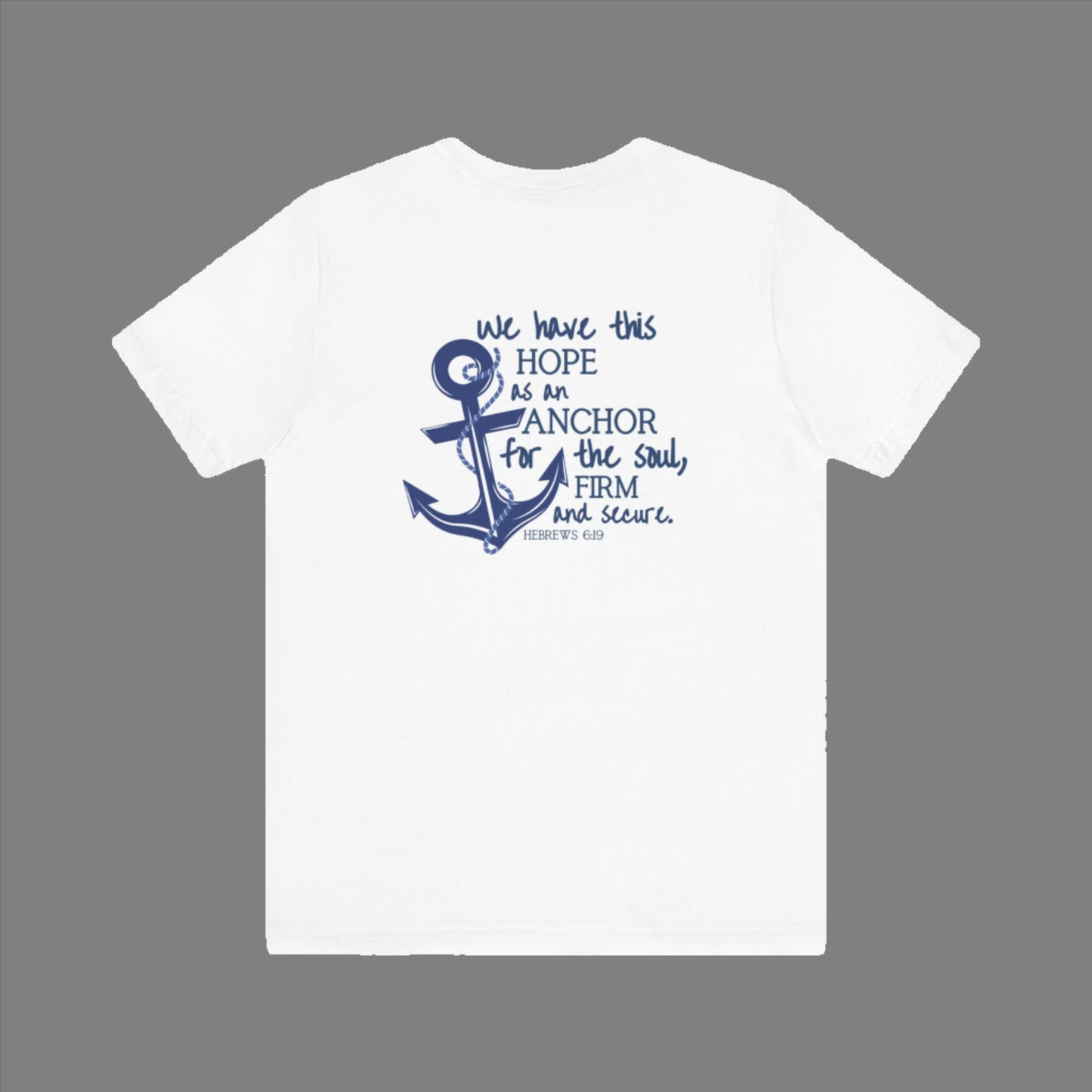 We have this hope as an anchor for the soul, firm and secure. Hebrews 6:19. This nautical Christian crewneck tee features a small anchor on the front with a large anchor and the Hebrews 6:19 bible verse in decorative font down the back. Cataldo Creations Christian Clothing, Christian T-Shirt, Christian Apparel. Bible Verse And Scripture Tees