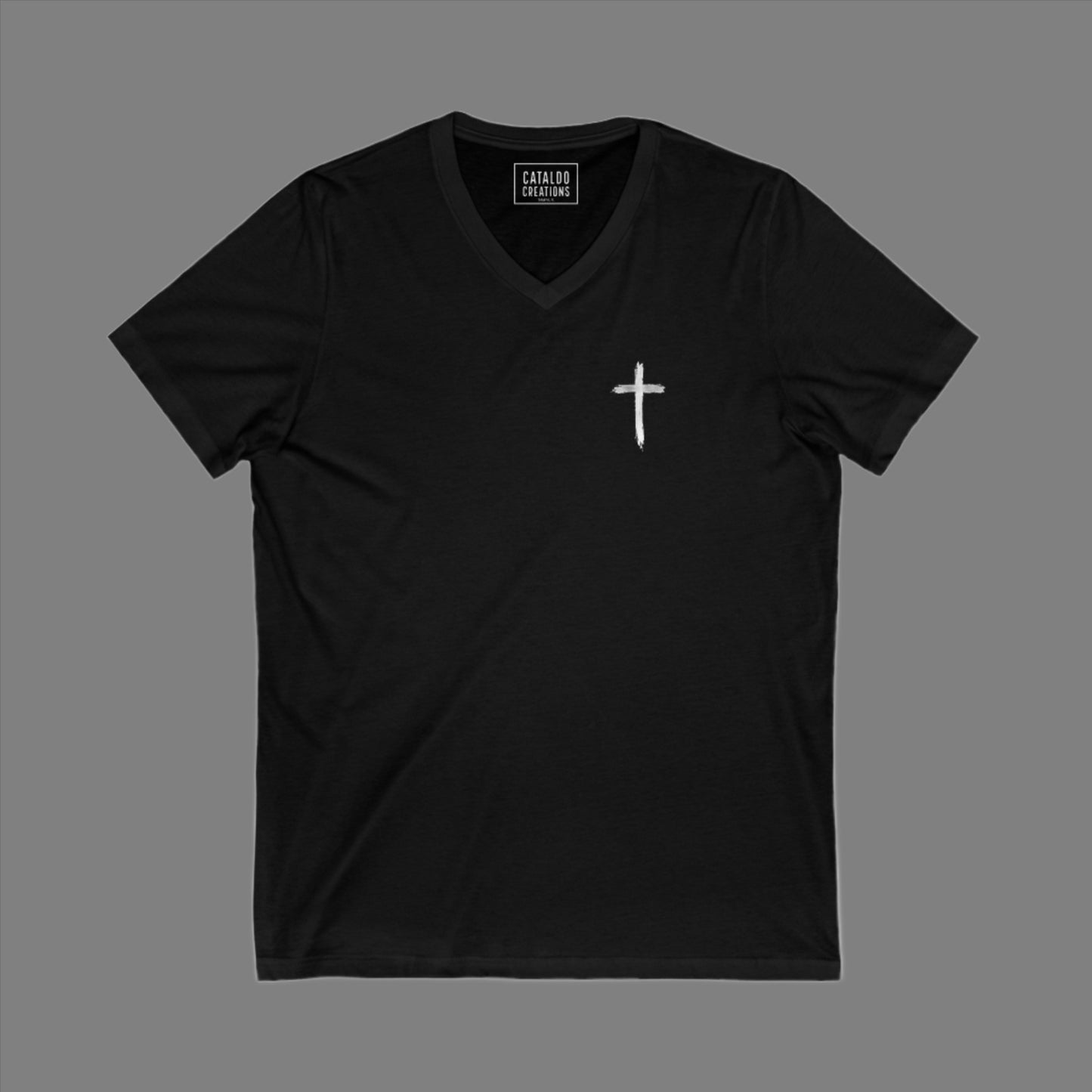 The 'Be Bold As A Lion' v-neck tee. The lion face pops with its gorgeous, lifelike markings throughout. In a big bold font, a reminder of God's word in Proverbs 28:1 from the Bible, to "Be Bold As A Lion". With a small cross on the front chest and available in different colors (and styles!) this t-shirt is one you will feel fearless wearing! Cataldo Creations Christian clothing. Faith Based apparel