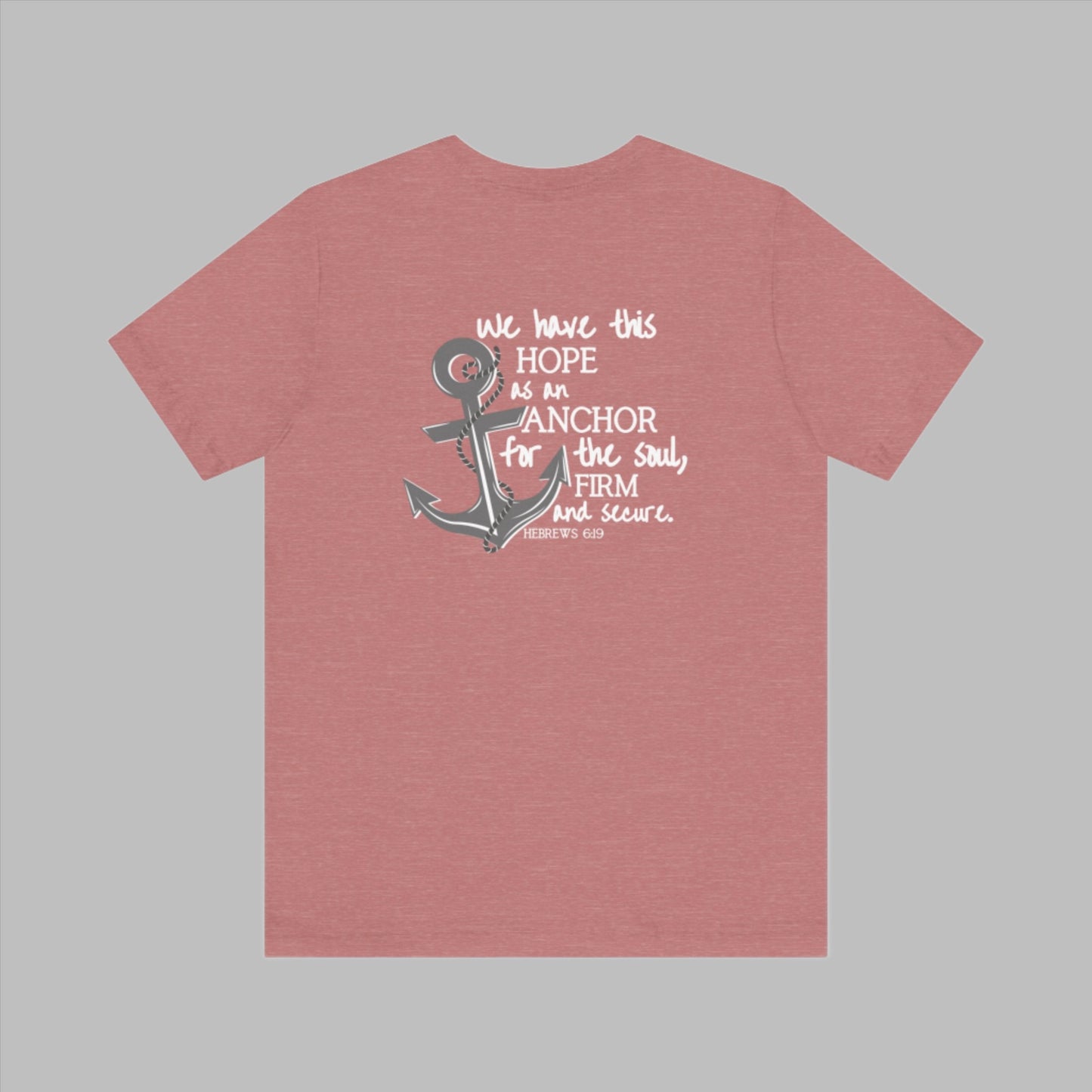 We have this hope as an anchor for the soul, firm and secure. Hebrews 6:19. This nautical Christian crewneck tee features a small anchor on the front with a large anchor and the Hebrews 6:19 bible verse in decorative font down the back. Cataldo Creations Christian Clothing, Christian T-Shirt, Christian Apparel. Bible Verse And Scripture Tees