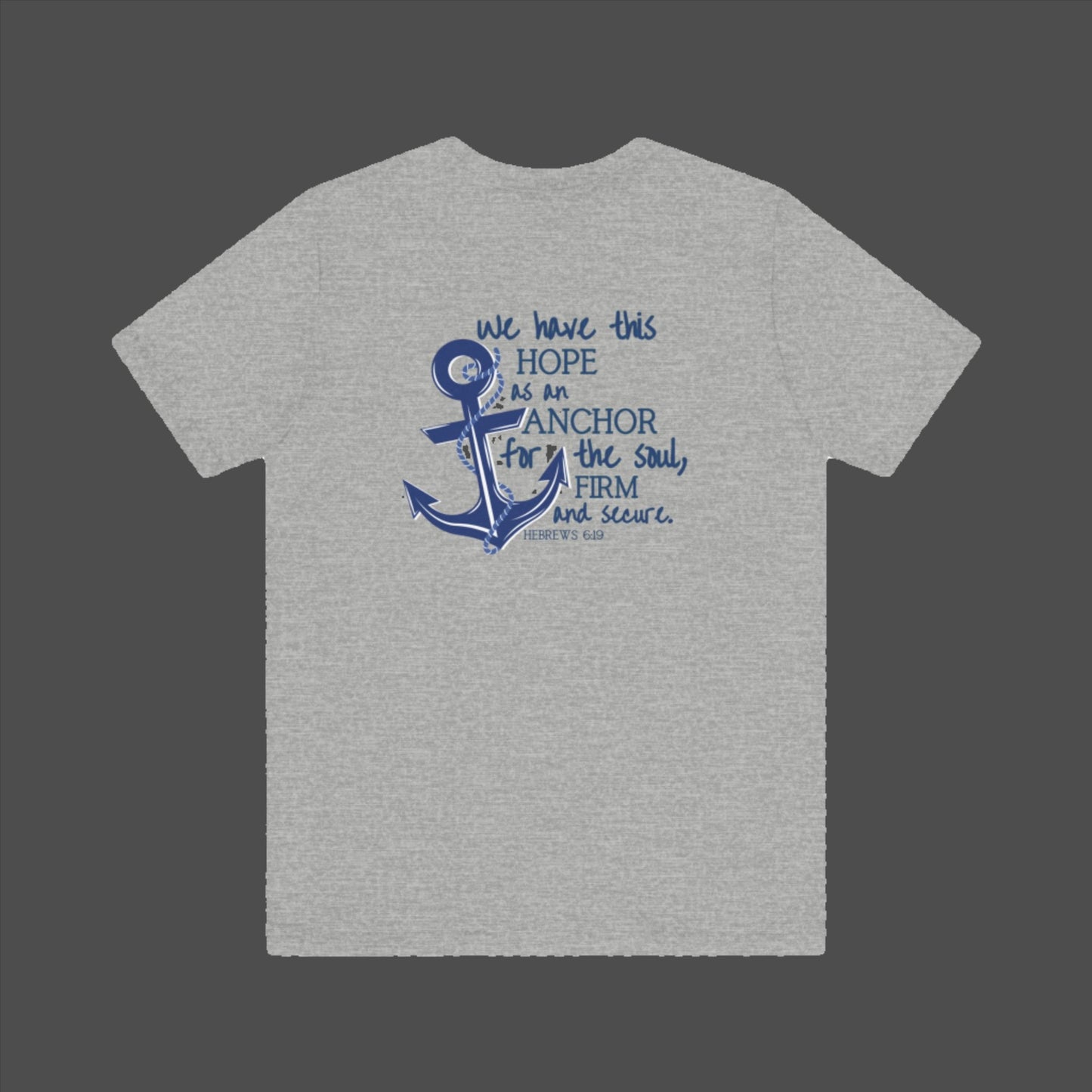 We have this hope as an anchor for the soul, firm and secure. Hebrews 6:19. This nautical Christian crewneck tee features a small anchor on the front with a large anchor and the Hebrews 6:19 bible verse in decorative font down the back. Cataldo Creations Christian Clothing, Christian T-Shirt, Christian Apparel. Bible Verse And Scripture Tees