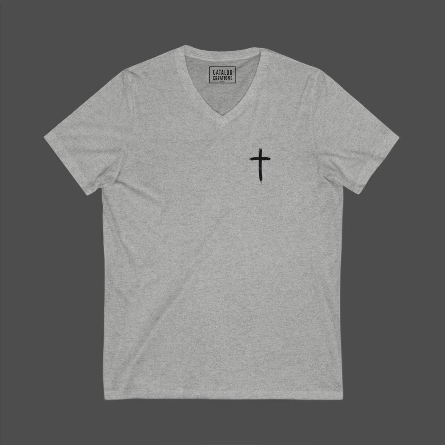 The 'Be Bold As A Lion' v-neck tee. The lion face pops with its gorgeous, lifelike markings throughout. In a big bold font, a reminder of God's word in Proverbs 28:1 from the Bible, to "Be Bold As A Lion". With a small cross on the front chest and available in different colors (and styles!) this t-shirt is one you will feel fearless wearing! Cataldo Creations Christian clothing. Faith Based apparel