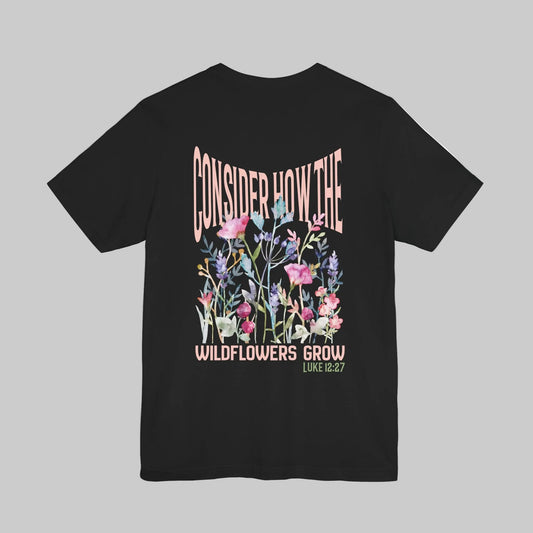 Unisex jersey short sleeve tee featuring floral design with Bible verse Luke 12:27 Christian inspirational shirt