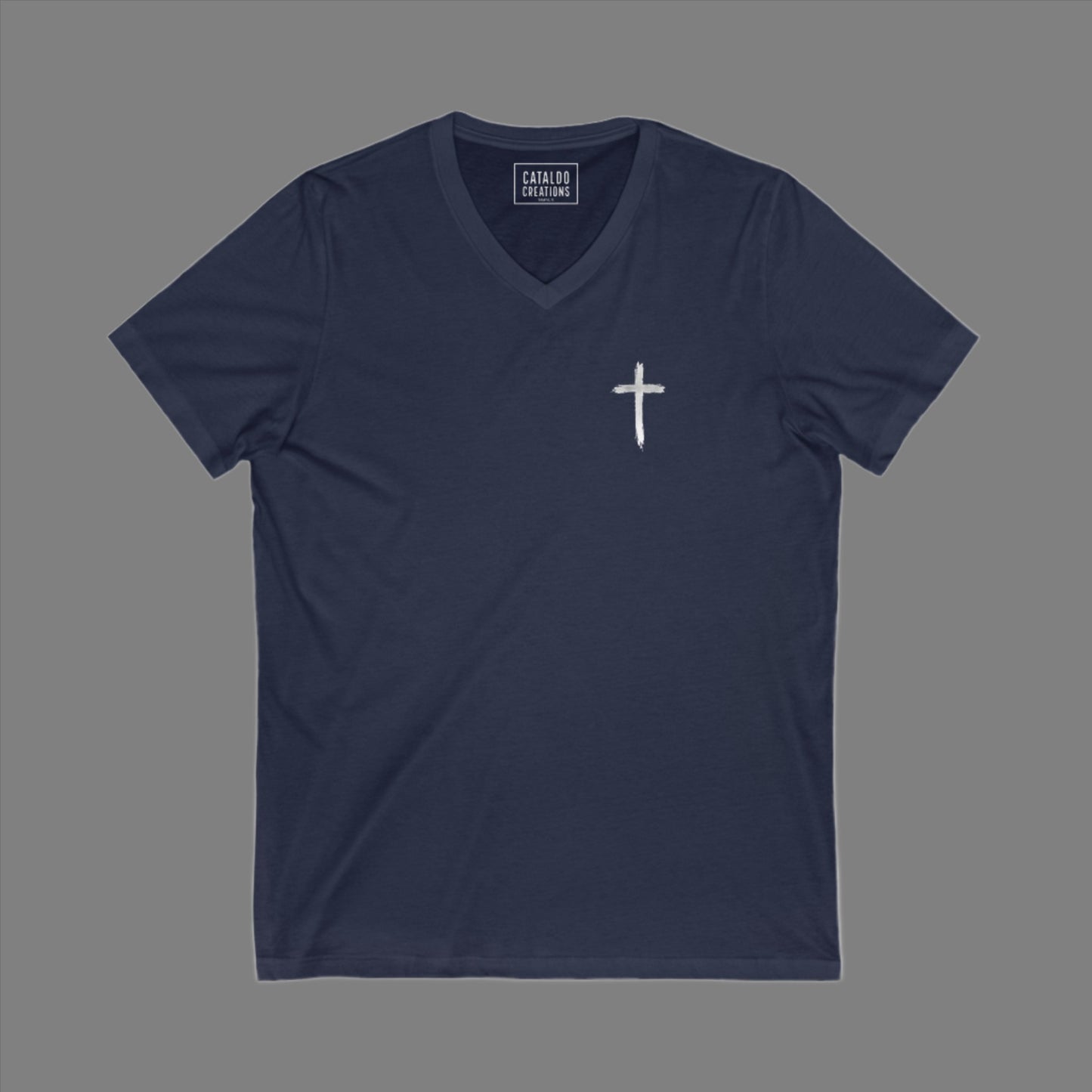 The 'Be Bold As A Lion' v-neck tee. The lion face pops with its gorgeous, lifelike markings throughout. In a big bold font, a reminder of God's word in Proverbs 28:1 from the Bible, to "Be Bold As A Lion". With a small cross on the front chest and available in different colors (and styles!) this t-shirt is one you will feel fearless wearing! Cataldo Creations Christian clothing. Faith Based apparel