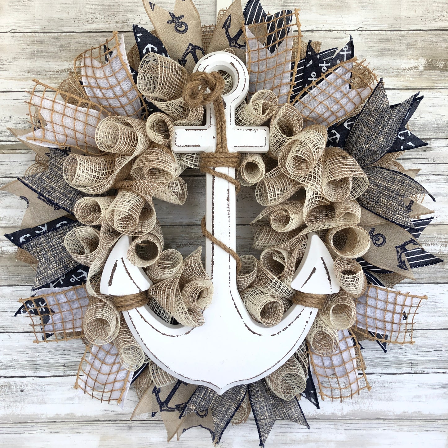 Nautical Anchor Door Wreath. Anchors Away! This beige, navy and white door wreath has a classic color scheme and subtle shimmer. This wreath will look great on your door or that open spot on your wall! Handmade Door Wreath.