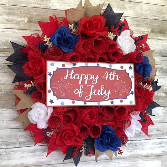 Happy 4th Of July Red White And Blue Patriotic Door Wreath. This red wreath pops like the fireworks on 4th of July! Decorated with red white and blue floral touches and ribbon. In center sits a wood Happy 4th of July sign. This wreath is handmade and one of a kind.