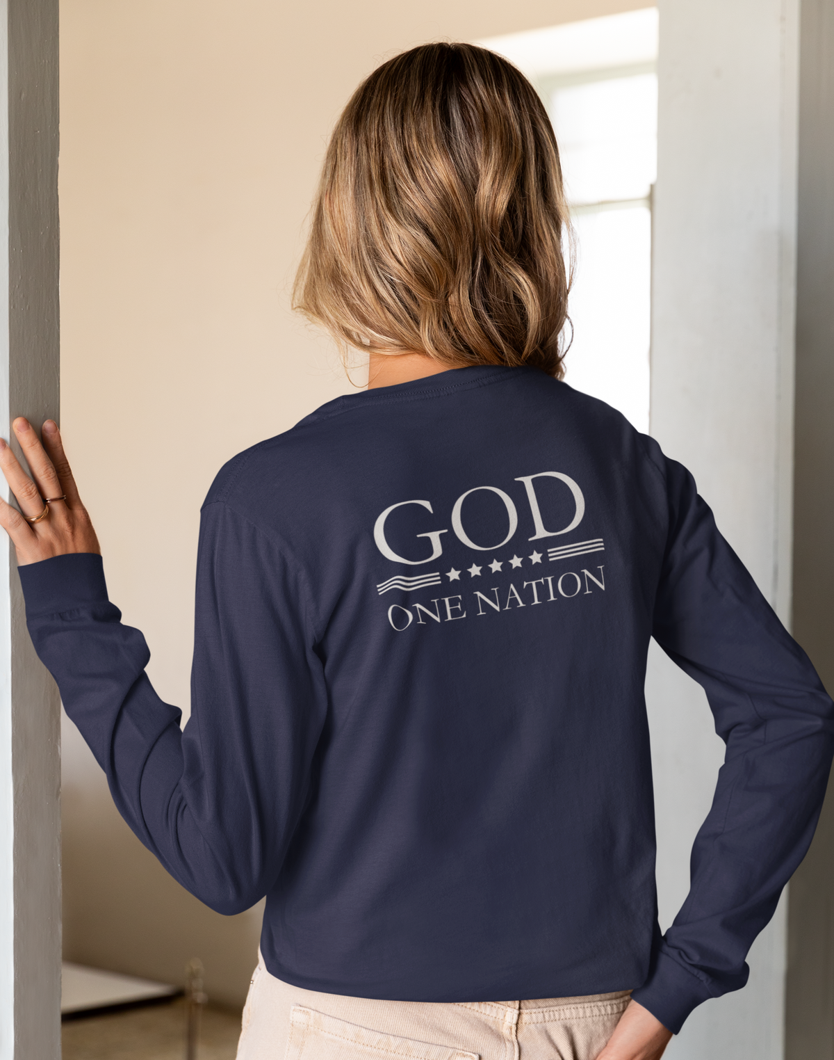 One Nation Under God, 1776 Patriotic long sleeve shirt for men and women. This Cataldo Creations tee has 1776 on the front chest pocket area and One Nation Under God on the back. Show your patriotism with this American Patriot long sleeve tee today!