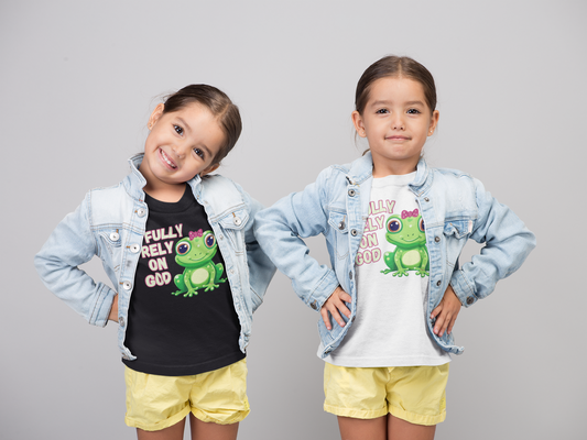 FROG. Fully Rely On God. This cute little girl toddler short sleeve t-shirt has an adorable green frog wearing a pink bow. Alongside are the words Fully Rely On God in light green and pink lettering. Perfect for your toddler girl! Christian toddler tee. Cataldo Creations apparel for toddlers