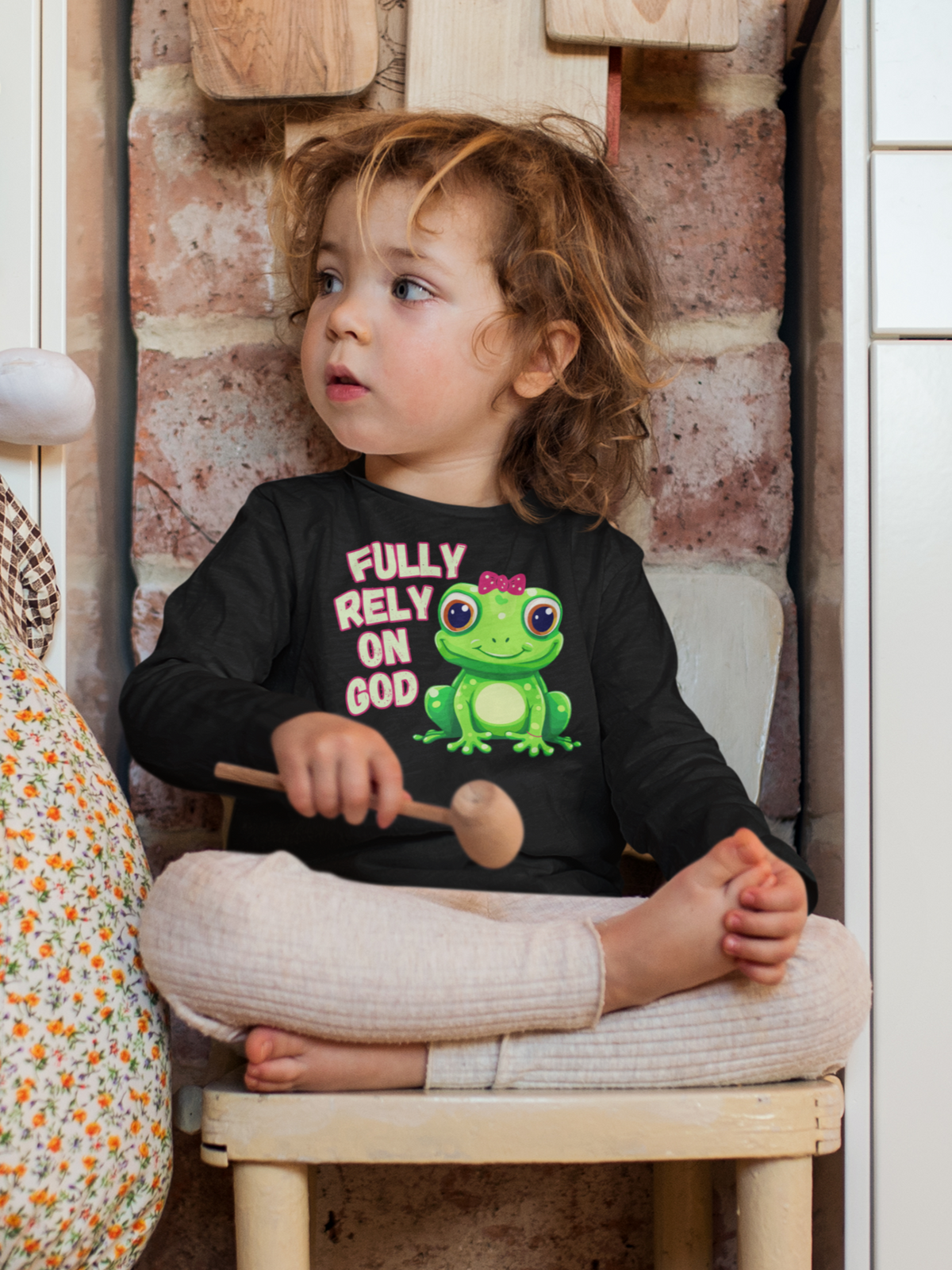 FROG. Fully Rely On God. This cute little girl toddler long sleeve t-shirt has an adorable green frog wearing a pink bow. Alongside are the words Fully Rely On God in light green and pink. Perfect for your toddler girl!