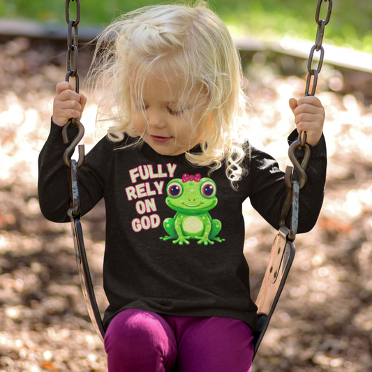 FROG. Fully Rely On God. This cute little girl toddler long sleeve t-shirt has an adorable green frog wearing a pink bow. Alongside are the words Fully Rely On God in light green and pink. Perfect for your toddler girl!