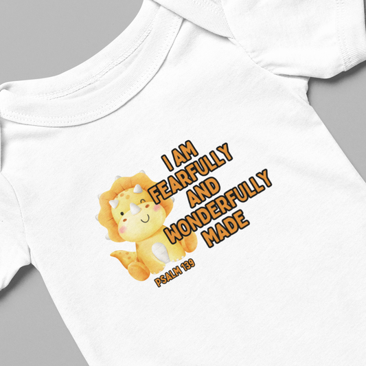 Experience the cuteness overload with our Fearfully Made Yellow Dinosaur Infant Onesie. Adorably designed for newborns, this onesie features a yellow dinosaur print and a powerful reminder from Psalm 139:14 - "I am fearfully and wonderfully made." Instill confidence and love in your little one with this unique onesie. Cataldo Creations