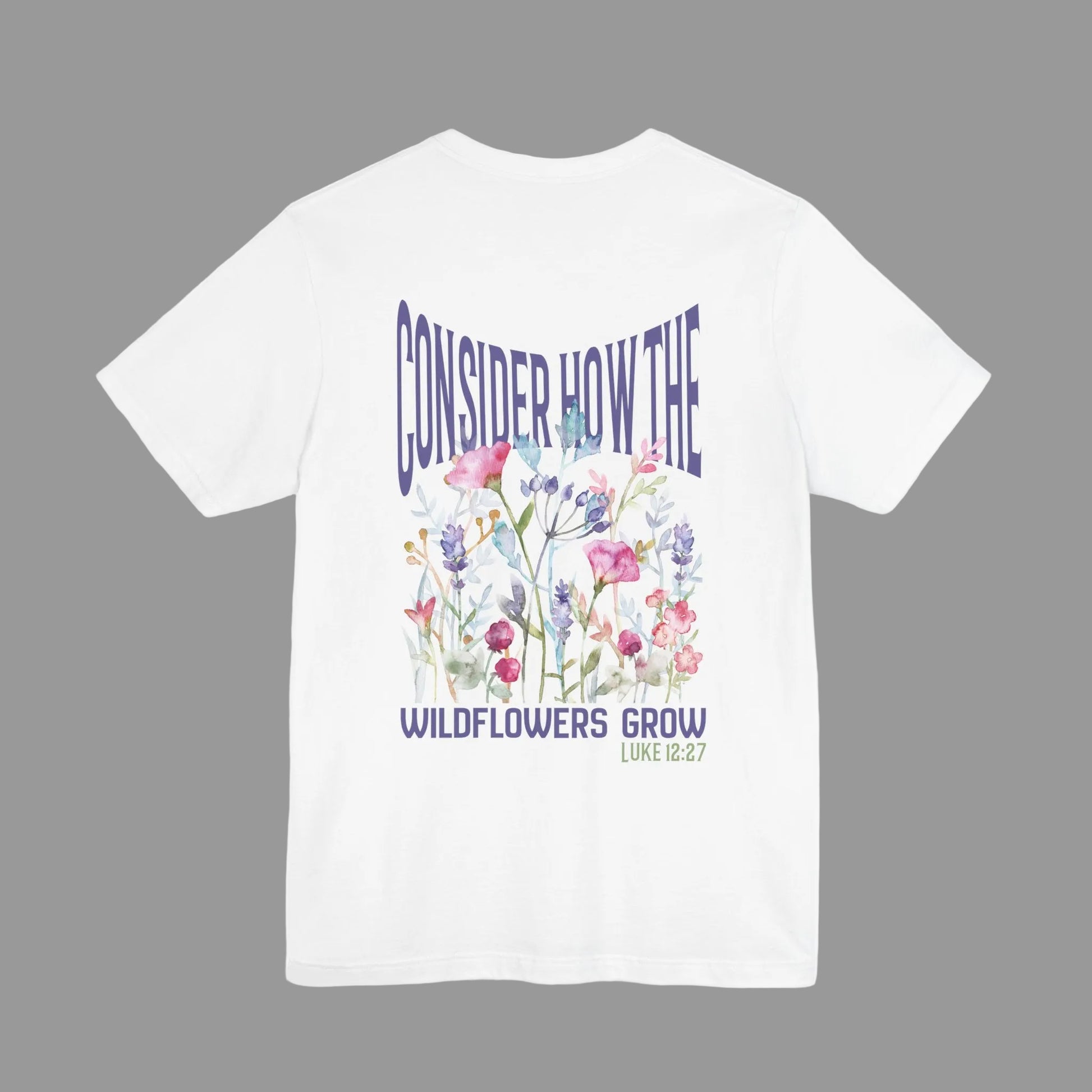 Unisex jersey short sleeve tee featuring floral design with Bible verse Luke 12:27 Christian inspirational shirt