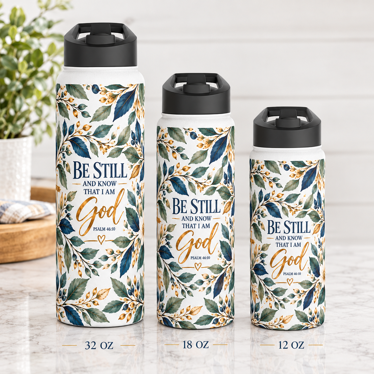 Be Still and Know Psalm 46:10 Christian insulated stainless steel water bottle featuring navy blue, sage green, and gold watercolor botanical artwork.