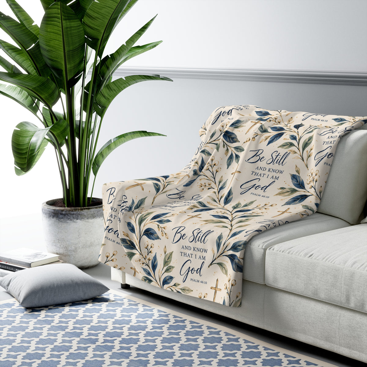 Be Still and Know Psalm 46:10 Christian sherpa blanket design featuring navy Scripture lettering, watercolor botanical leaves, gold crosses and an ivory background.