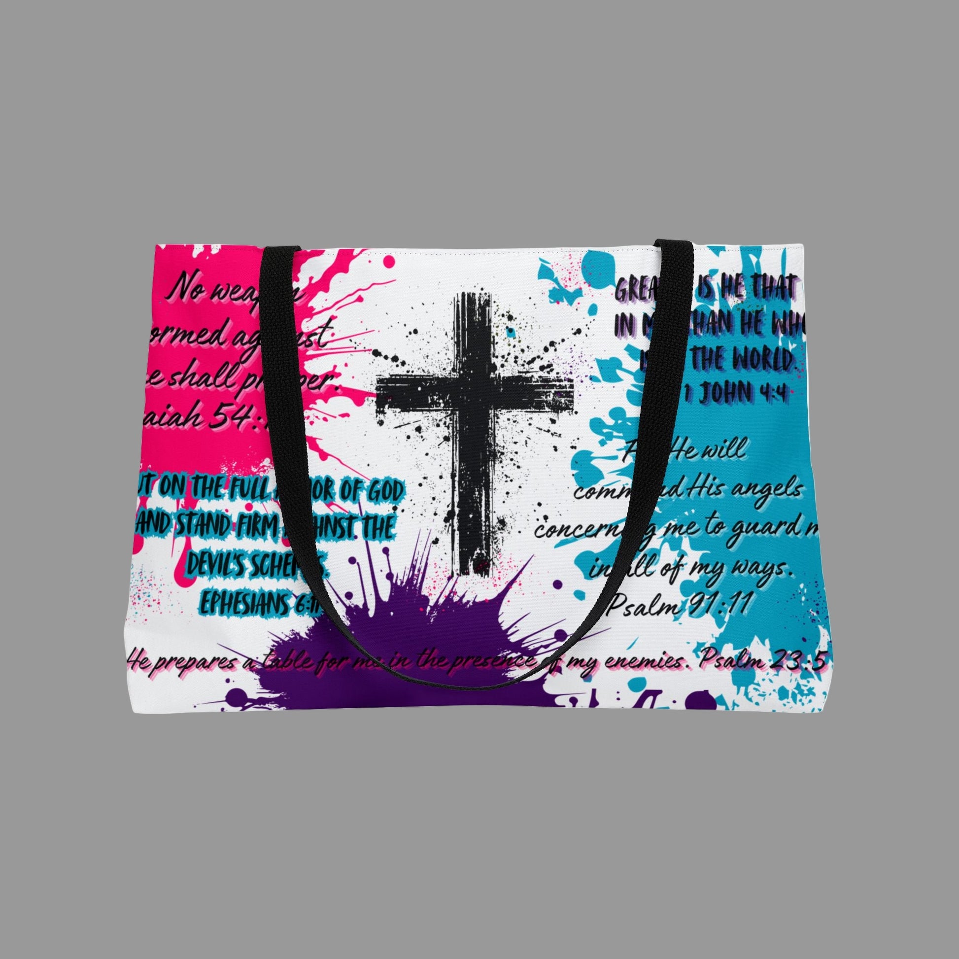 Colorful tote bag with cross design and text on a white background