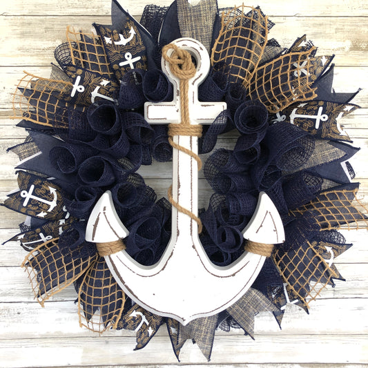 Nautical Anchor Door Wreath. Handmade Door Wreath. Anchors Away! This navy and white door wreath is rich in color and class. The white wood anchor pops off it’s navy backdrop and it is a must have addition to your home decor