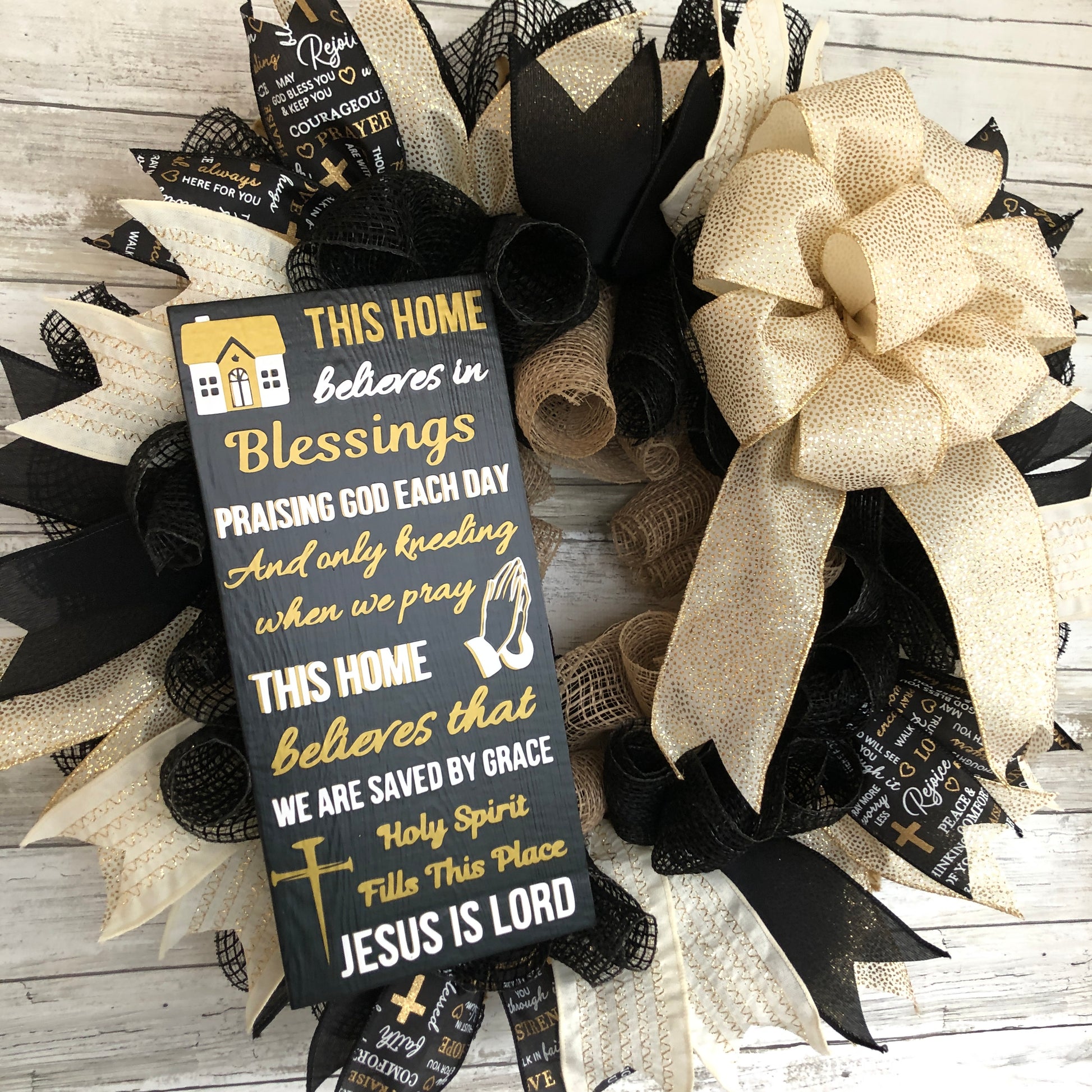 This Home Believes in Sign and wreath.  Black and gold. 