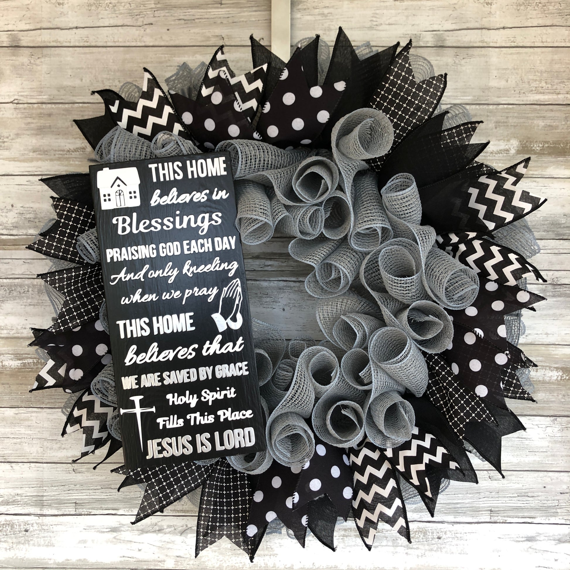 This Home Believes in Sign and wreath.  Silver and black. grey and black