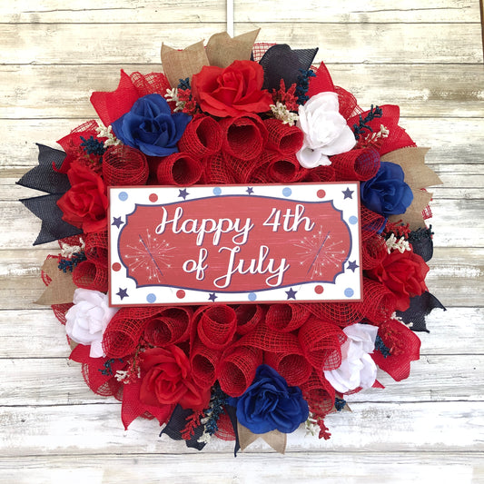 Happy 4th Of July Red White And Blue Patriotic Door Wreath. This red wreath pops like the fireworks on 4th of July! Decorated with red white and blue floral touches and ribbon. In center sits a wood Happy 4th of July sign. This wreath is handmade and one of a kind. 