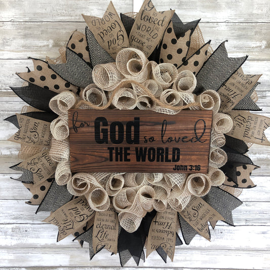 For God so loved the world, that he gave his only begotten Son, that whoever should believe in Him, will not perish, but have everlasting life. John 3:16. This beige and black wreath features ribbon with the John 3:16 scripture and a pine sign centered on the wreath containing the very first section of this bible verse. "For God so loved the world" John 3:16. Cataldo Creations Handmade Door Wreath. Christian Door Wreath. Christian Door Decor.