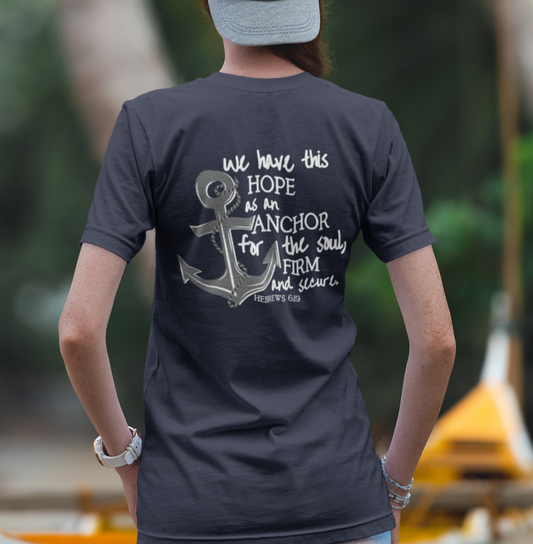 We have this hope as an anchor for the soul, firm and secure. Hebrews 6:19. This nautical Christian v-neck tee features a small anchor on the front with a large anchor and the Hebrews 6:19 bible verse in decorative font down the back. Cataldo Creations Christian Clothing, Christian T-Shirt, Christian Apparel. Bible Verse And Scripture Tees