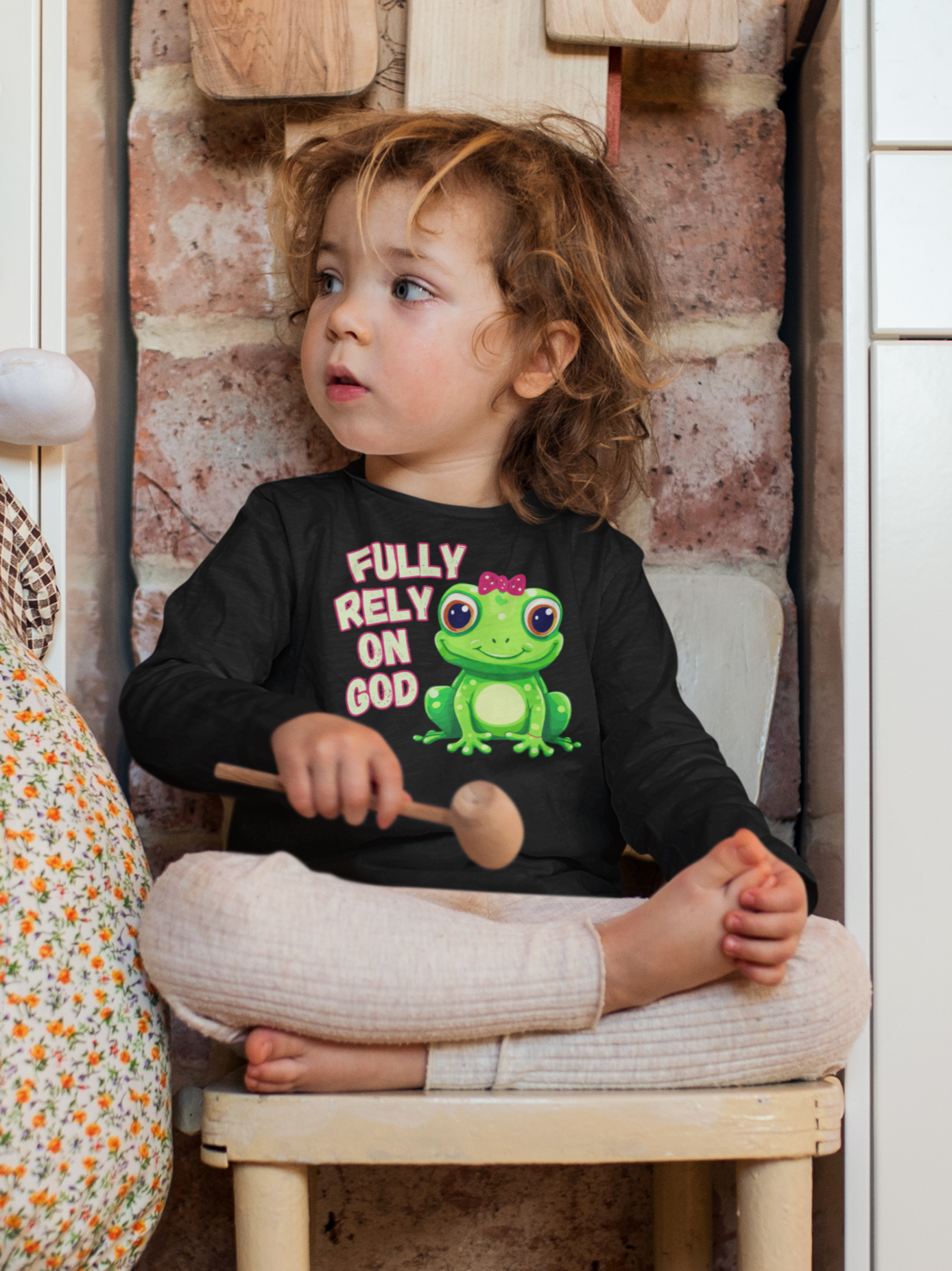 FROG. Fully Rely On God. This cute little girl toddler long sleeve t-shirt has an adorable green frog wearing a pink bow.  Alongside are the words Fully Rely On God in light green and pink.  Perfect for your toddler girl! 