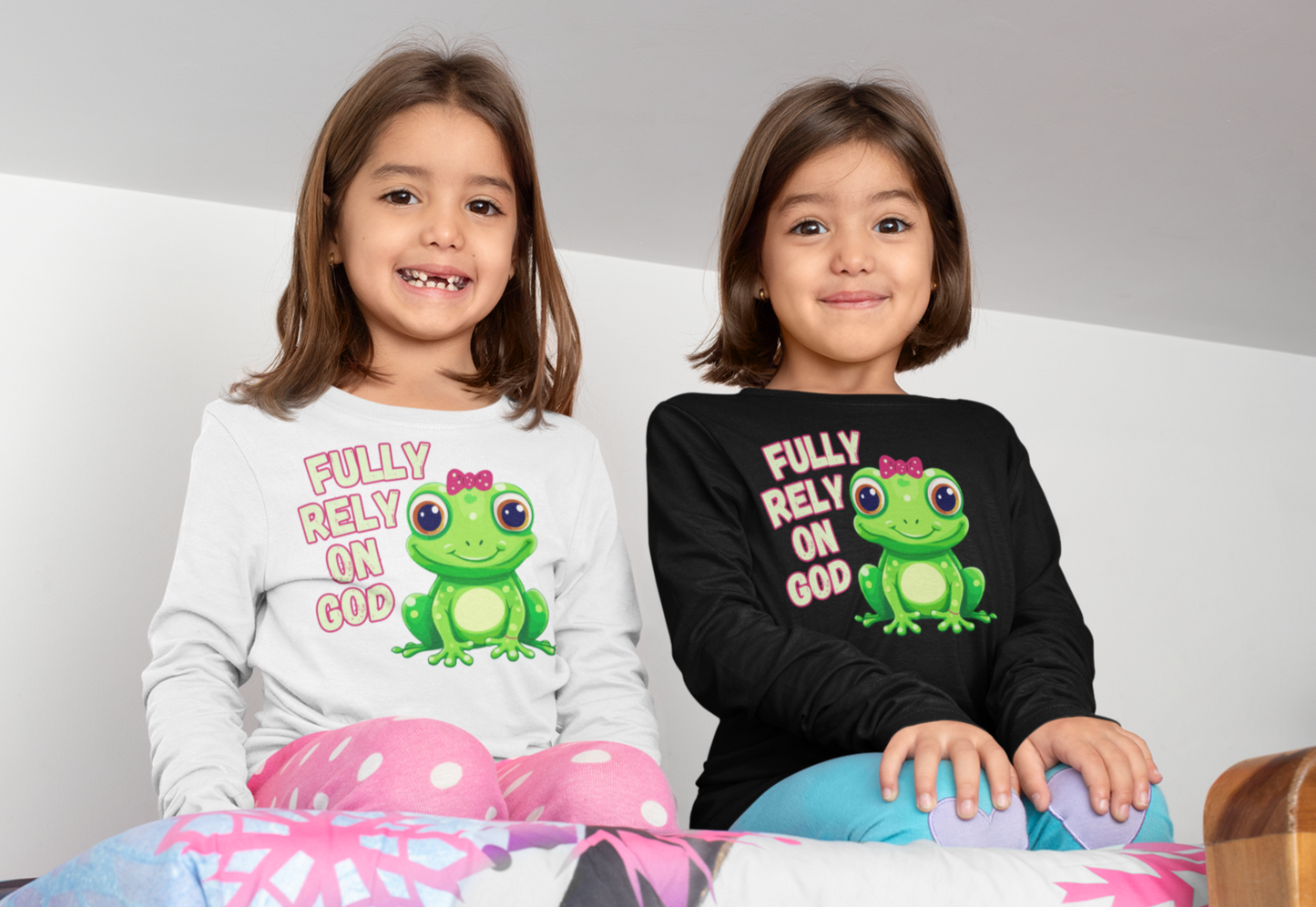 FROG. Fully Rely On God. This cute little girl toddler long sleeve t-shirt has an adorable green frog wearing a pink bow.  Alongside are the words Fully Rely On God in light green and pink.  Perfect for your toddler girl! 